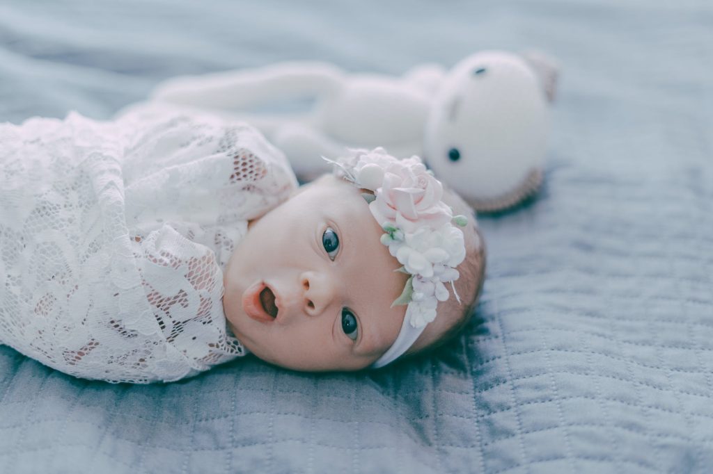 a cute newborn baby yawning