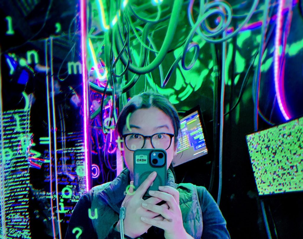 Hiroko Nishimura standing in the Kiro Haunted House at AWS re:Invent 2025
